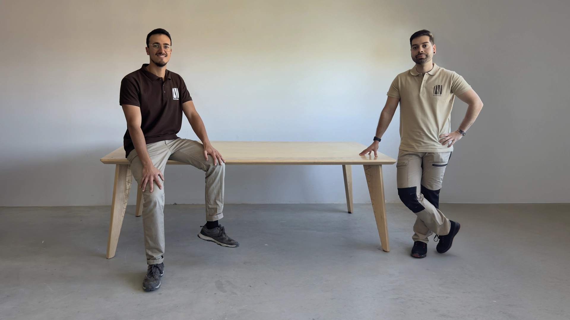 The Studio Tablas team in their Granada workshop, next to a solid wood table