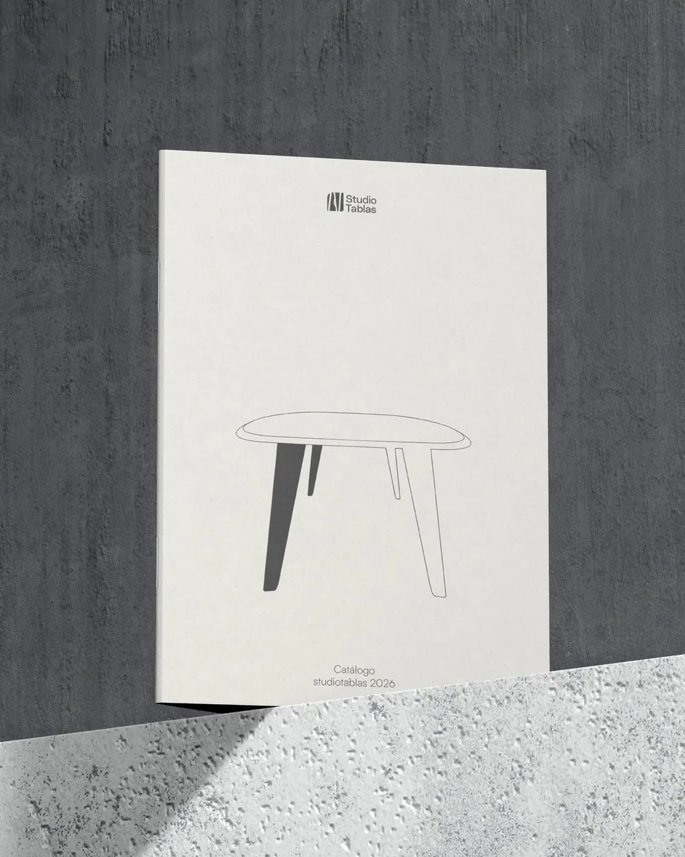 Studio Tablas catalogue cover with a table drawn in line