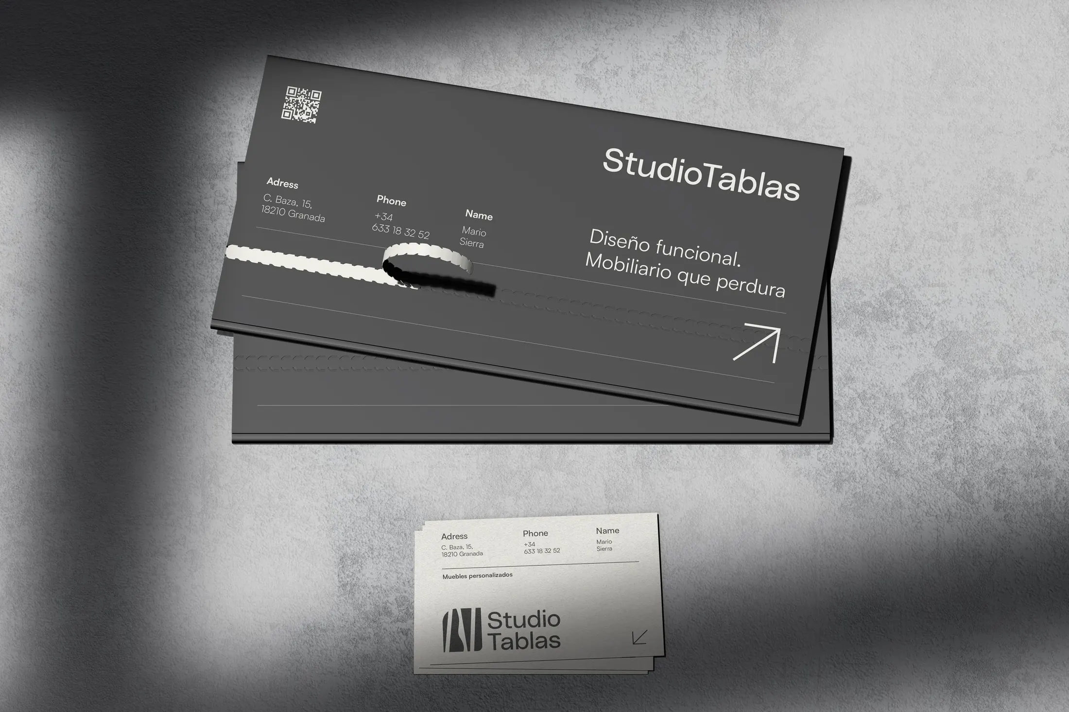 Dark Studio Tablas business cards with the tagline and the symbol