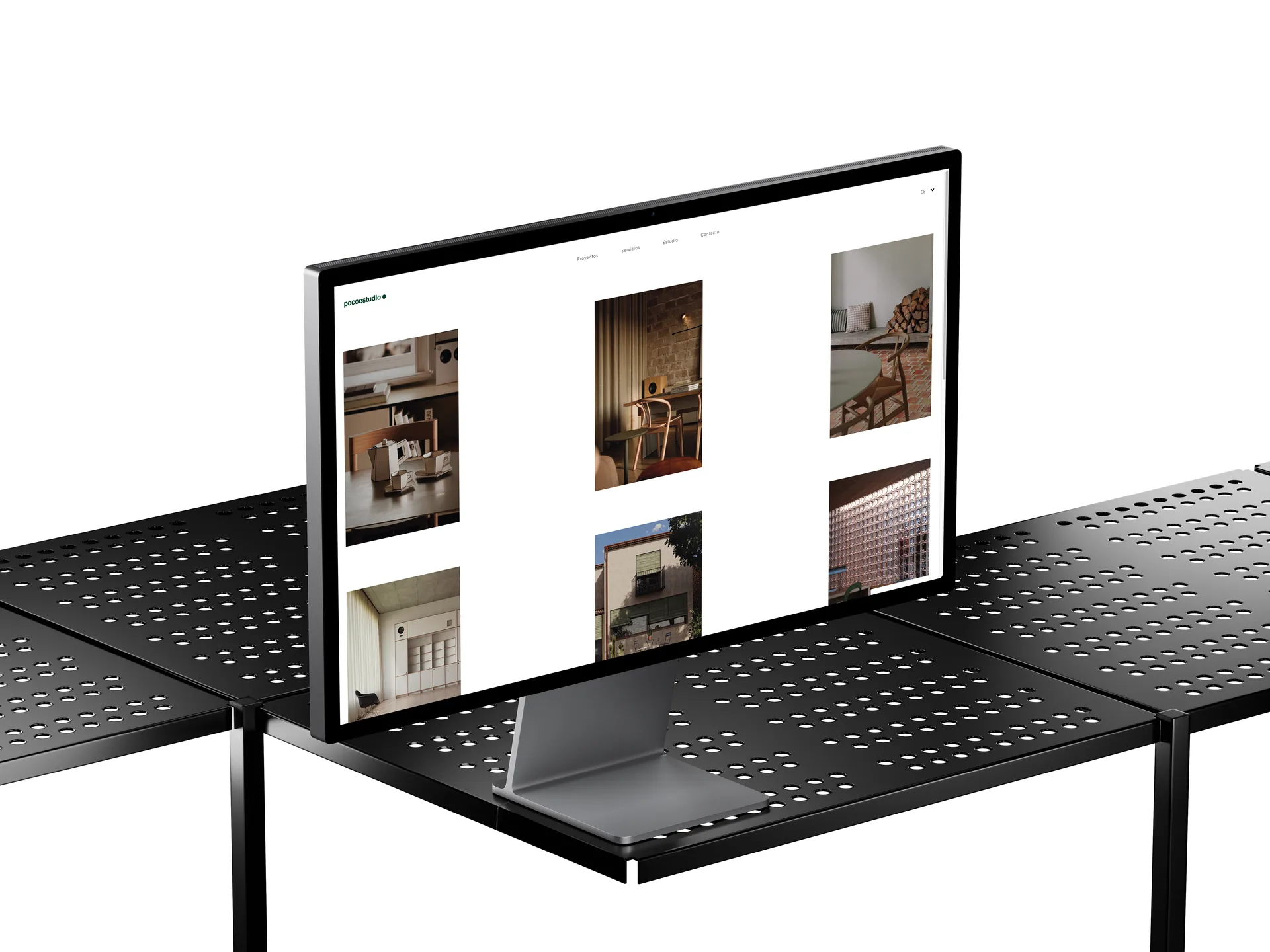 Diseño web para un estudio de interiorismo: el portfolio de pocoestudio.es en un monitor
